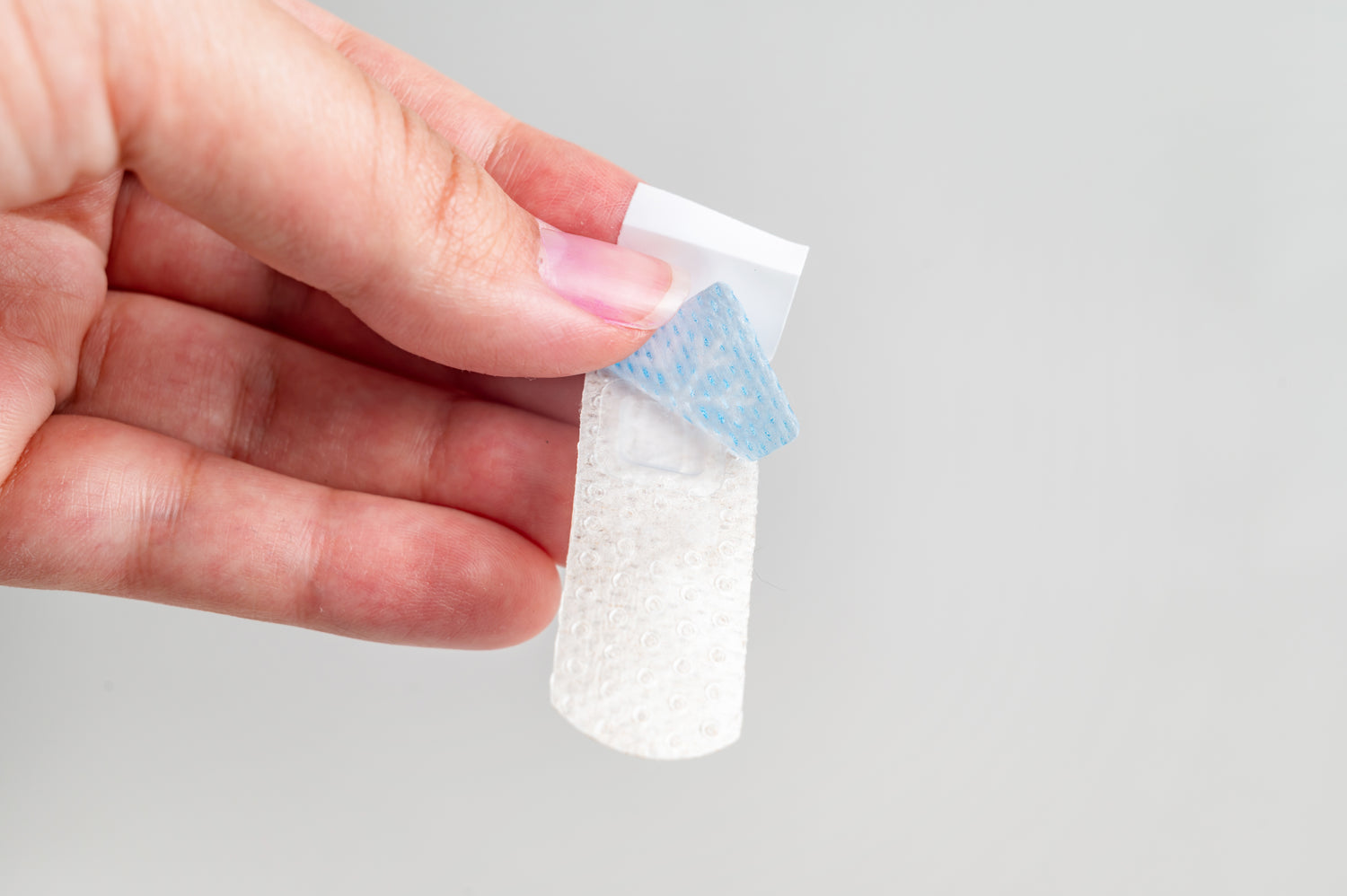 Parent applying BooBoo Cooler to a child — the moment it earns loyalty