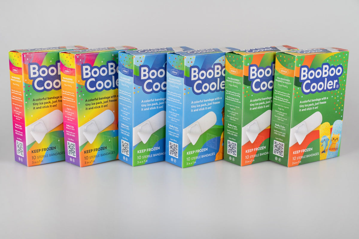 Six BooBoo Cooler boxes in a row: two Rainbow Magic, two Action Chill and two Animal Pack