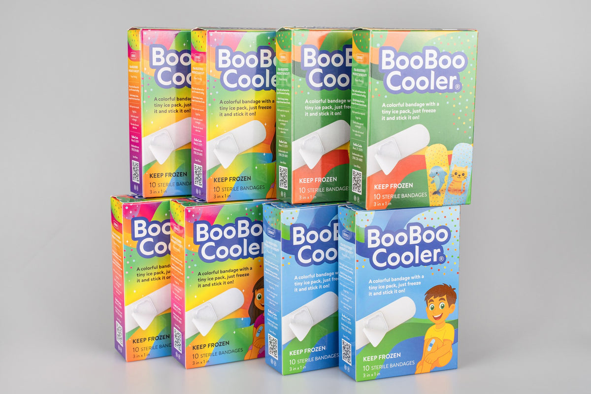 Eight BooBoo Cooler boxes stacked: four Rainbow Magic, two Action Chill and two Animal Pack